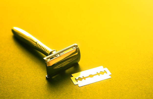 Razor and blade on the table. Stylish men set. Idea for a gift. Barber shop things.