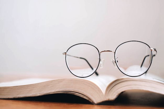 Reading thin frame glasses on book