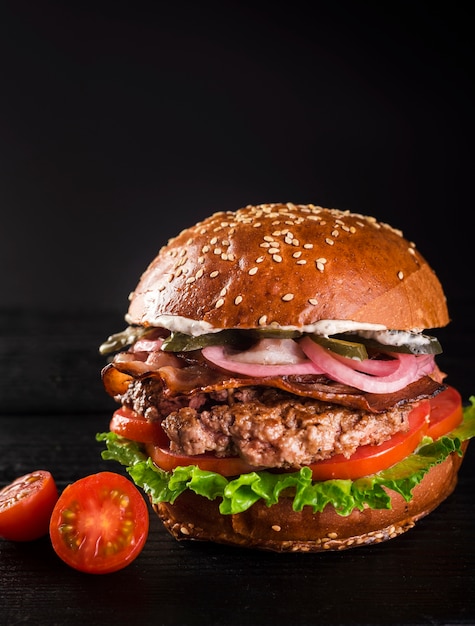 Ready to be served classic hamburger with cherry tomatoes