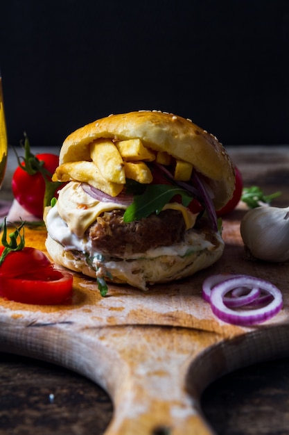 Real American bacon burger with fries and beer