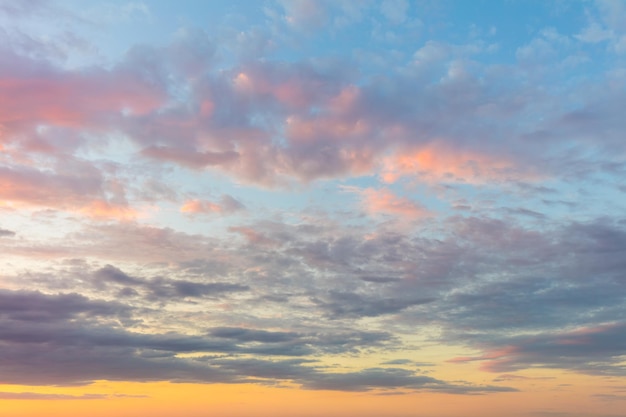 Real background of majestic sunrise sky with gentle colors of soft clouds big size