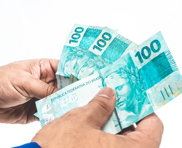 real brazilian currency a businessman holding brazilian real money bills from brazil