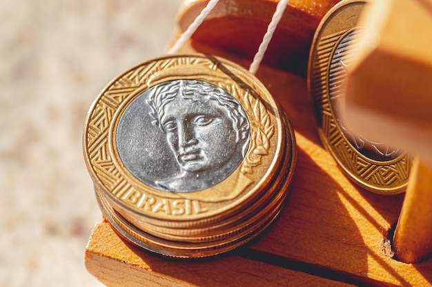 real brl brazil coin in macro photo on a wooden object