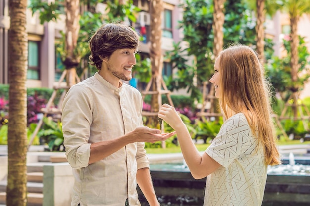 Real estate agent giving keys to apartment owner, buying selling property business. Close up of male hand taking house key from realtor. Mortgage for purchasing flat, getting access to own home