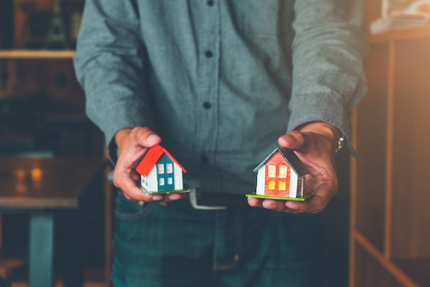 Real estate agent handing over house model