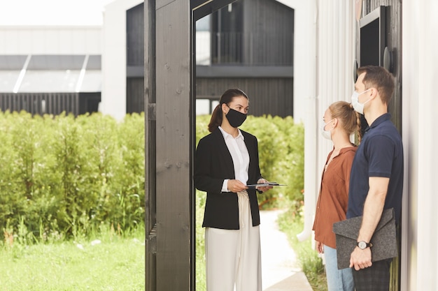 Real Estate Agent Wearing Mask at House Tour