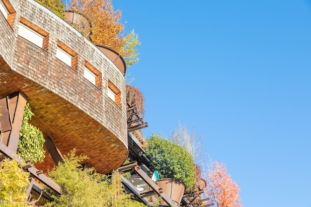 Real estate green residential building in Turin Italy Exterior with modern design plants and wood integrated