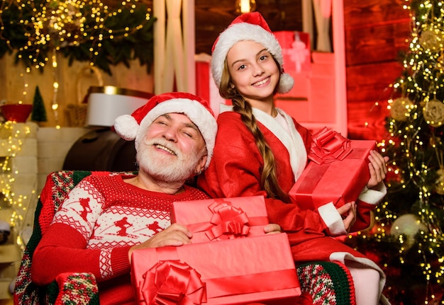 Real happiness xmas happiness and joy Present for kid grandpa and grandchild at home family holiday weekend Little girl with santa man father and daughter love christmas happy new year