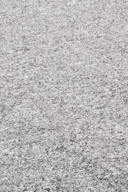 Real heather grey knitted fabric made of synthetic fibres textured background