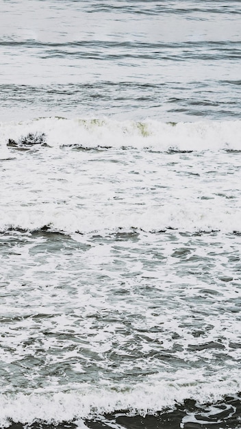 Real photo sea water waves abstract background nature power pale grey light contrast matte more tone in stock