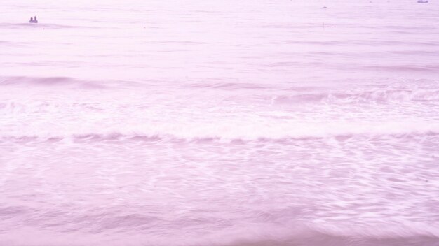 Real photo sea water waves abstract background nature power pale light pink more tone in stock