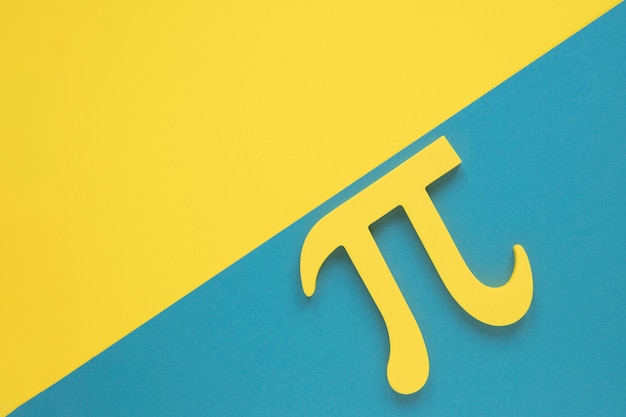 Photo real science pi symbol on yellow and blue copy space background