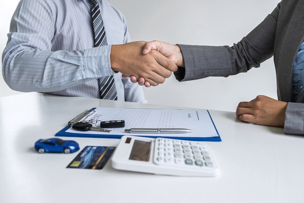 Realtor agent manager shaking hands with a client