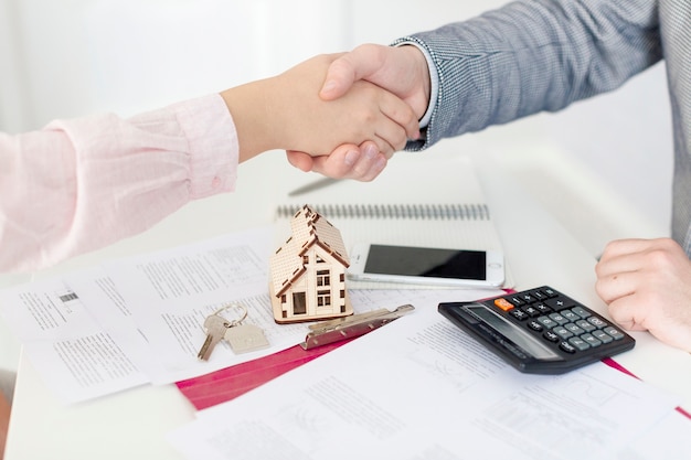 Realtor and client shaking hands