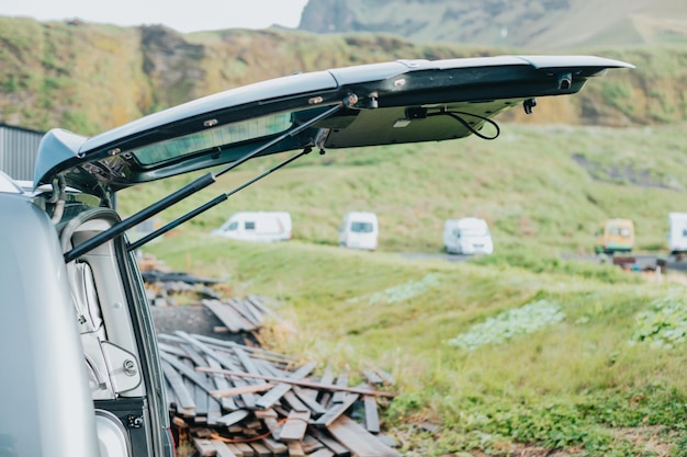 Rear door of a van wide open road travel concept route through wild lands