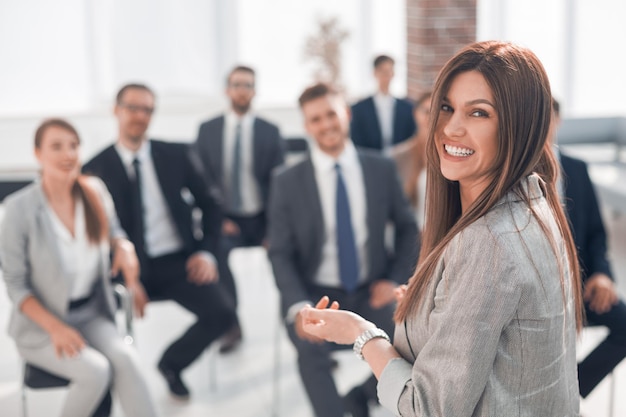 Rear view business woman makes a report for the business teamphoto with copy space