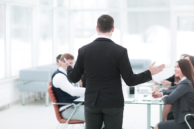 Rear view.the businessman holds a briefing with the business team.photo with copy space