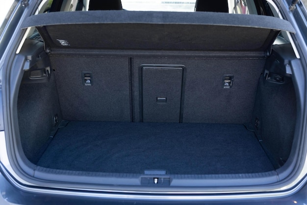 Rear view of the car open trunk modern hatchback car with open empty trunk the car boot is open