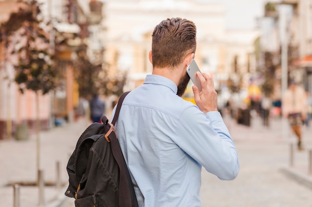 Rear view of a man talking on cellphone