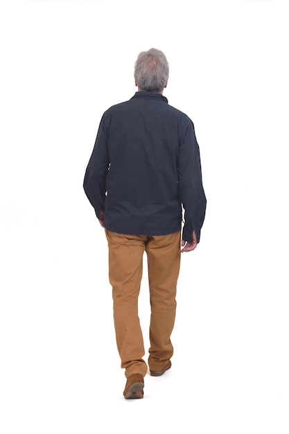 Rear view of a man walking on white background on white background