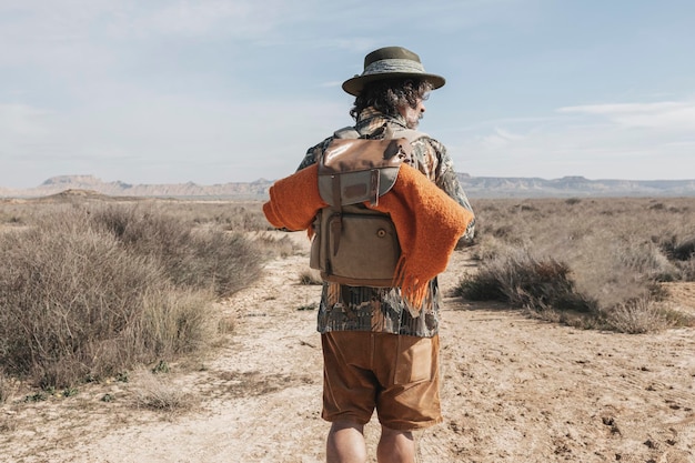 Rear View Of A Man With A Backpack In The Bardenas Desert Navarre