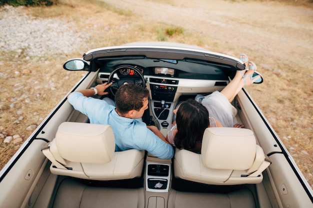 Rear view of people sitting in car