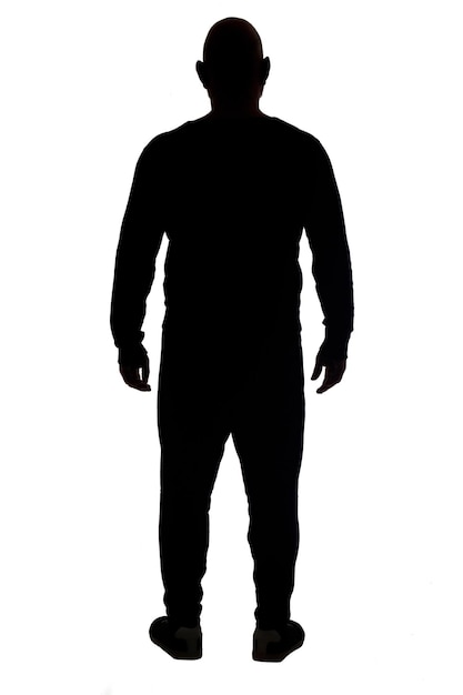 Rear view of the silhouette of a man wearing casual