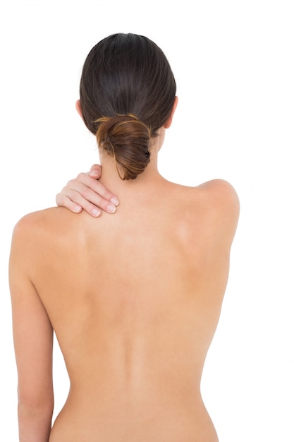 Rear view of a topless fit woman with shoulder pain