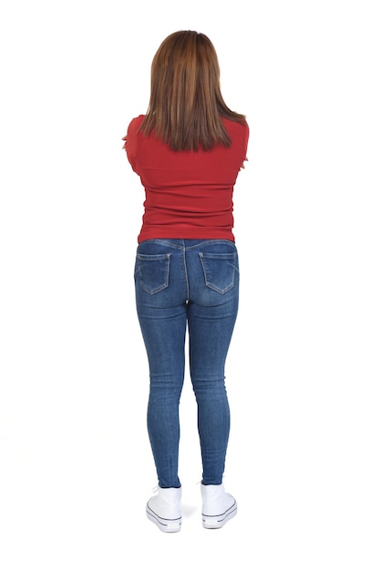 Rear view of a woman arms crossed on white background