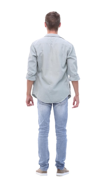 Rear view young man in jeans looking at copy spaceisolated on white background