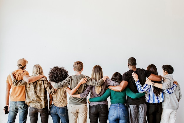 Rearview of diverse people hugging each other