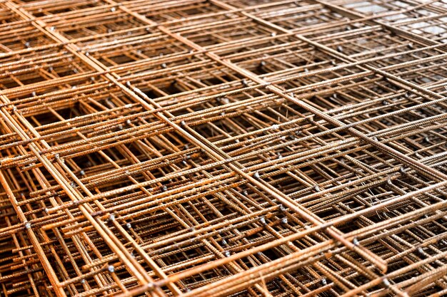 Photo rebar reinforcing bars or steel close up reinforcement steel wires mesh of steel used as a tension device in reinforced concrete