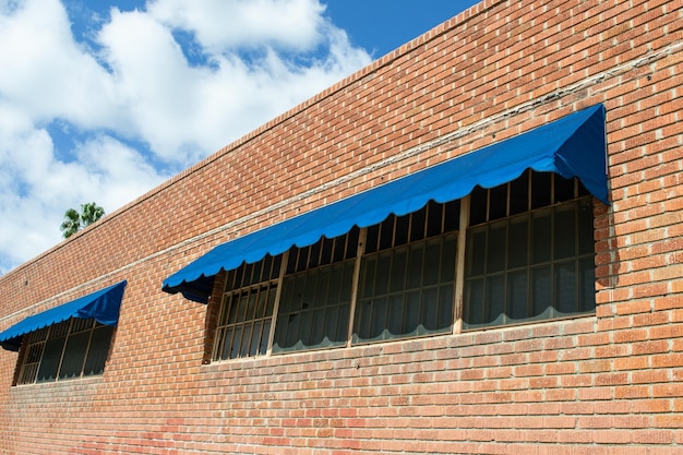 receding perspective vintage red brick building blue sky