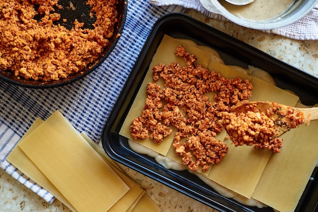 Recipe for homemade lasagna with tomato sauce and meat. Phased recipe.