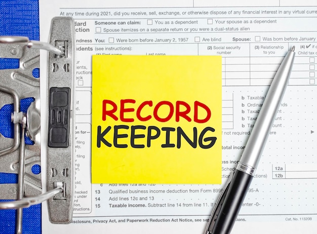 Photo record keeping words on paper notebook with pen