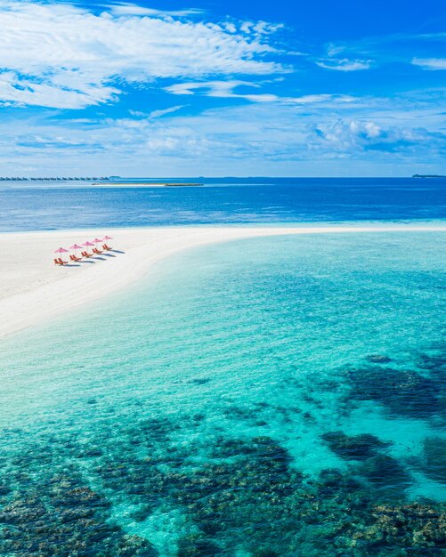 Recreational summer travel tourism. Aerial landscape view with chairs and umbrellas paradise island