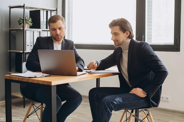 Recruiter during business job interview in office with male candidate