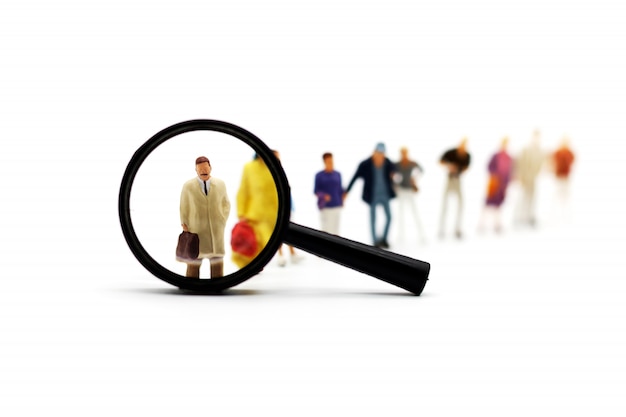 Photo recruitment zoom magnifying glass picking business person candidate people group.