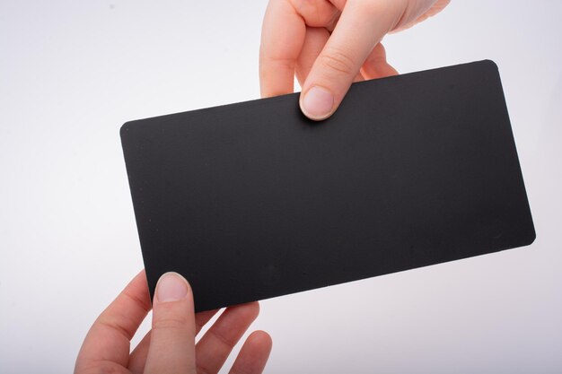 Rectangular shaped black notice board in hand