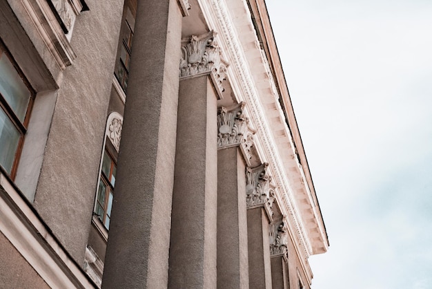 Rectangular stone columns with stucco on the facade of old historical building Design Pillar Architecture History Heritage Historical Urban Post Rightangled porch column Ageold