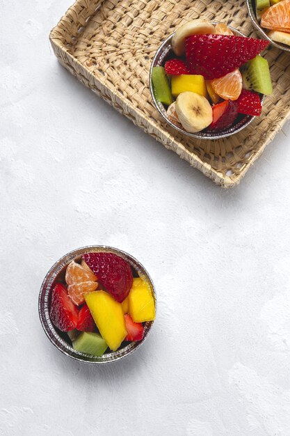 Recyclable take away fruit cups.Vegan food concept. Delivery