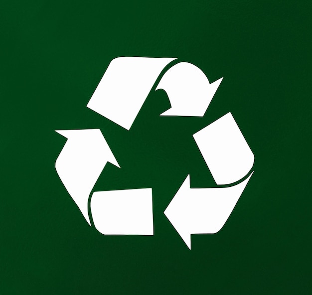 Recycled arrow icon on green background