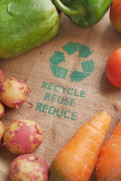 Recycled arrows sign on a shopping bag with vegetable