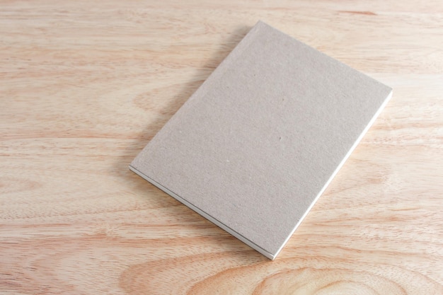 Recycled paper book on wooden background