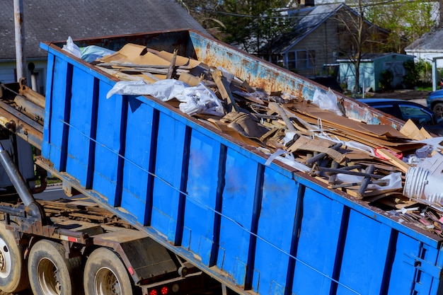 Photo recycling garbage collector truck loading waste and removable container.