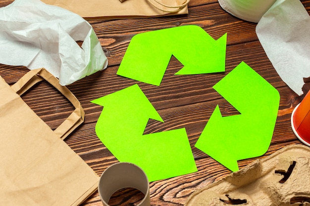 recycling symbol on table background