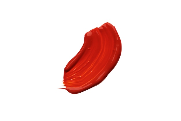 Red acrylic paint brush stroke isolated on a white background.