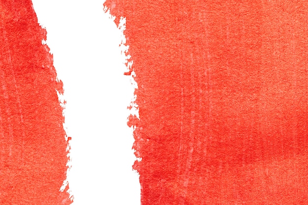 Red acrylic paint texture on white paper background