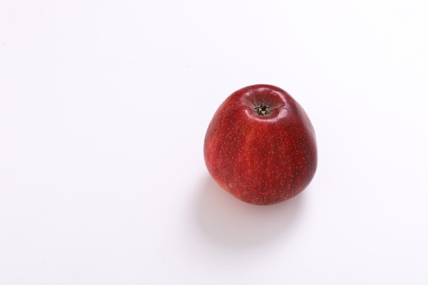 Red apple with half and slice