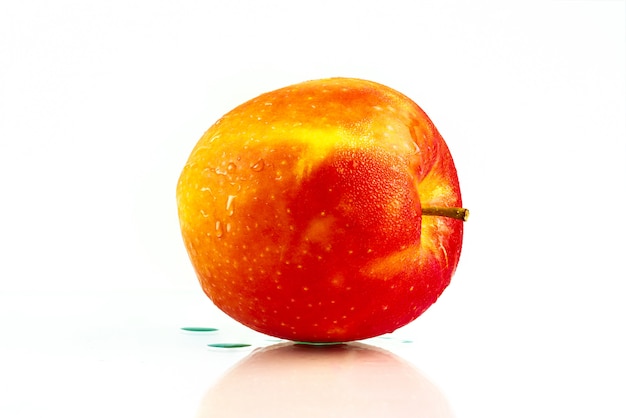 A red apple with water drops on skin with copy space